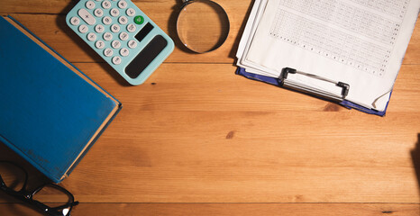 Poster - wooden desktop with dokument and book