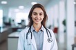© olga_demina - smiling female doctor looking at camera, medicine healthcare concept