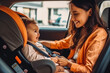© VisualProduction - Smiling mother fastening seat belt on her newborn baby in a car seat, baby smiling and being happy. Generative AI