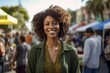 © Leon Waltz - Medium shot portrait photography of a grinning woman in her 30s that is wearing a chic cardigan against a neighborhood block party with food and games background .  Generative AI
