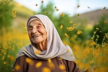 Medium Shot Portrait Photography Of A Pleased Woman In Her 90s That Is Wearing Hijab Against A Picturesque Sunflower Field With Bees And Butterflies Background .  Generative AI