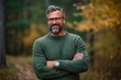 © Leon Waltz - Medium shot portrait photography of a pleased man in his 40s that is wearing a cozy sweater against a woodland or enchanted forest background .  Generative AI