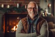 © Leon Waltz - Portrait of a smiling senior man in front of fireplace at home