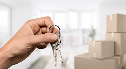 Young woman hand having keys from new house