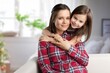 © BillionPhotos.com - Happy child hugs young mother