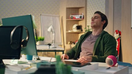 Wall Mural - Exhausted artist rubbing neck at office close up. Designer man feeling headache