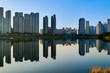© Mehmet Chelebi - view of downtown city skyline with lake.Gwanggyo lake park suwon Korea.09.04.2023
