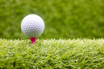 Wall Mural - Golf ball is on green grass.