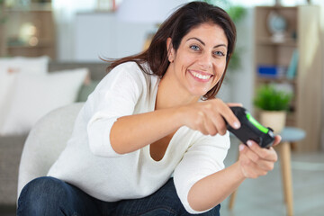 woman playing with computer game console