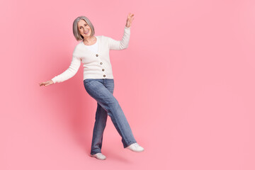 Sticker - Full body photo of excited positive aged person dancing clubbing empty space isolated on pink color background