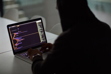 Hacker, code and programming with person and laptop screen for ransomware, cyber security and phishing. Coding, technology and crime with programmer typing for fraud, network system and data at night