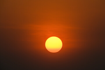 Sticker - big orange sun on sunset background