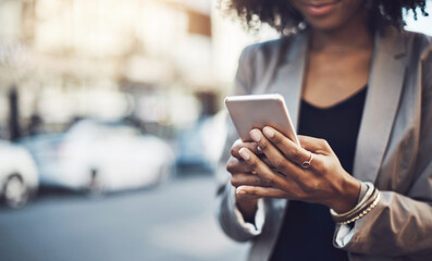 Canvas Print - Woman, hands and phone in city for communication, social media or chatting and texting outdoors. Hand of business female on mobile smartphone for online browsing, travel or networking in a urban town