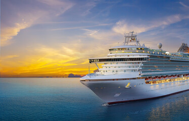 Luxury cruise ship sailing to port on sunrise 