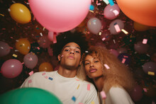 Generative AI Illustration Of Cool Young African American Couple Looking At Camera Amidst Colorful Balloons And Confetti During Party