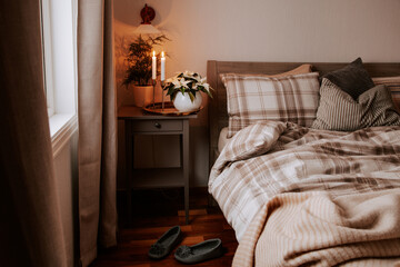 Wall Mural - cozy scandinavian bedroom interior in natural tones, blanket candles houseplants