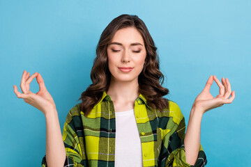 Canvas Print - Photo of sweet adorable cute woman dressed plaid shirt closed eyes practicing yoga isolated blue color background