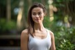 © Markus Schröder - Photography in the style of pensive portraiture of a happy girl in her 30s working out against a serene zen garden background. With generative AI technology