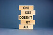 One size does not fit all symbol. Concept words One size does not fit all on wooden blocks. Beautiful grey table grey background. One size does not fit all business concept. Copy space.