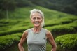 © Markus Schröder - Headshot portrait photography of a satisfied mature girl working out against a serene tea garden background. With generative AI technology