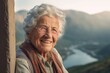 Close-up portrait photography of a satisfied old woman smiling against a scenic mountain overlook background. With generative AI technology