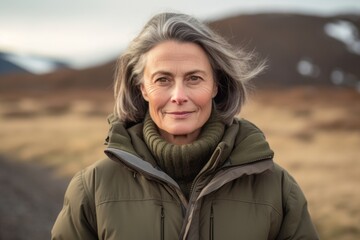 Wall Mural - Medium shot portrait photography of a glad mature woman wearing a warm parka against a national park background. With generative AI technology