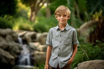 Wall Mural - Medium shot portrait photography of a grinning kid male wearing a casual short-sleeve shirt against a serene rock garden background. With generative AI technology