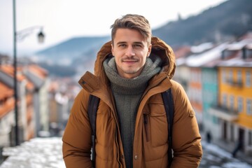 Wall Mural - Lifestyle portrait photography of a satisfied boy in his 30s wearing a warm parka against a picturesque old town background. With generative AI technology