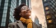 © Adriana - Happy wealthy rich successful black businesswoman standing in big city modern skyscrapers street on sunset thinking of successful vision, dreaming of new investment opportunities. Generative AI
