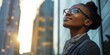 © Adriana - Happy wealthy rich successful black businesswoman standing in big city modern skyscrapers street on sunset thinking of successful vision, dreaming of new investment opportunities. Generative AI