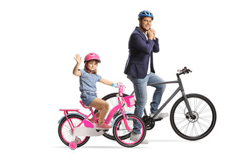 Wall Mural - Girl and a man on bicycles wearing helmets