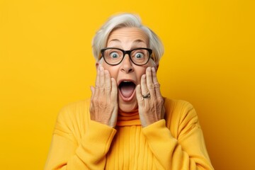 Medium shot portrait photography of a grinning mature woman making a surprise gesture by covering one's mouth against a pastel yellow background. With generative AI technology