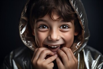 Wall Mural - Close-up portrait photography of a happy kid male covering one's mouth against a metallic silver background. With generative AI technology