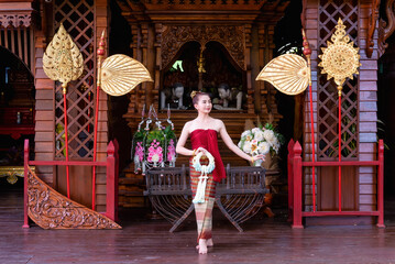 Thai woman dressed in traditional Northern Thailand culture costume.