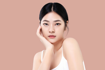 Studio shot of Beautiful young Asian woman with clean fresh skin isolated on pink background, Face care, Facial treatment, Cosmetology, beauty and spa.