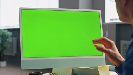 Wall Mural - Manager video calling greenscreen computer office closeup. Businessman gesturing