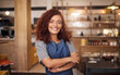 © Delmaine Donson/peopleimages.com - Coffee shop, barista and portrait of woman in cafe for service, working and crossed arms. Small business owner, restaurant startup and happy female waitress with pride in cafeteria ready to serve