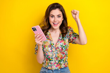 Poster - Photo of funny delighted lady use gadget playing internet game raise fist up winning isolated bright color background