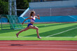 © Михаил Решетников - Young caucasian woman is engaged in jogging at the stadium outdoors.