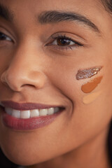 Wall Mural - close up face of mixed race woman with foundation on cheek
