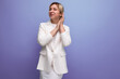 © Ivan Traimak - stylish young blond office woman in white jacket on studio background with copy space