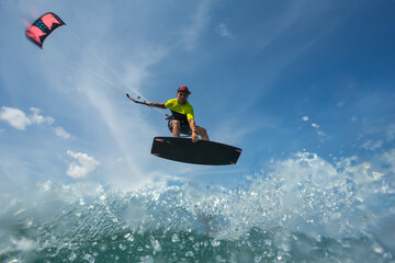 A kite surfer rides the waves