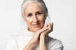 © deniskomarov - Portrait of an elegant old woman with gray hair and a well-groomed face with a nice smile and natural beauty