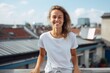 © Markus Schröder - Environmental portrait photography of a happy girl in her 30s wearing a casual t-shirt against a rooftop terrace background. With generative AI technology