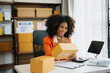 © laddawan - Small business entrepreneur SME freelance woman working at home office, BOX,tablet and laptop online, marketing, packaging, concept.