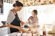 © Cecilie Arcurs/peopleimages.com - Mother, cooking or happy girl baking in kitchen as a family with a young kid learning cookies recipe at home. Cake pastry, baker or mother helping or teaching daughter to bake for child development