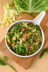 Wall Mural - Stewed young cabbage with dill and sausage