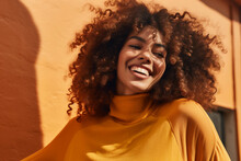 Generative AI Illustration Cheerful Of Young African American Girl With Curly Hair And Looking Away Next To A Orange Wall
