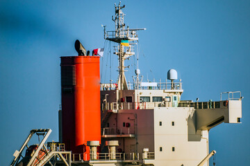 Wall Mural - The chimney and the captain's bridge of the ship close-up releases smoke from the chimney