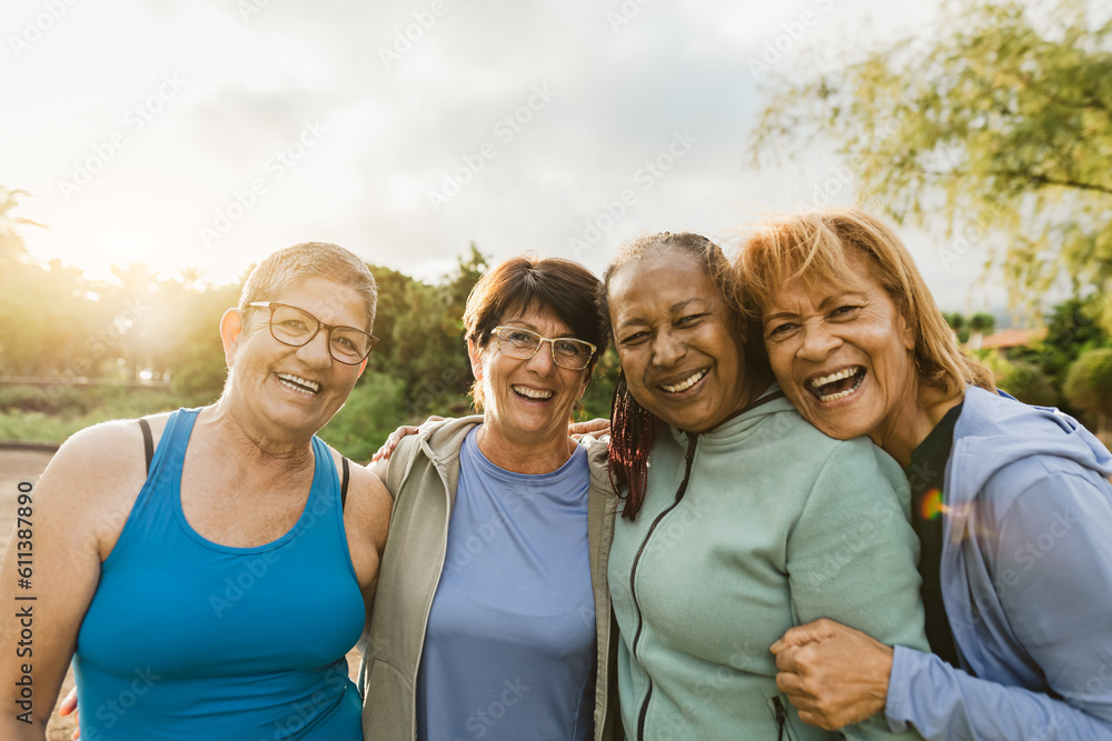 Happy multiracial female friends having fun smiling in front of the ...